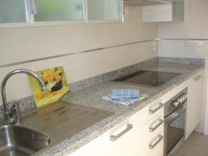 a kitchen counter top with a sink and a sink at Gemelos 26 - Zand Properties in Benidorm