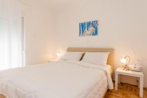 Postel nebo postele na pokoji v ubytování Apartments Kukuriku