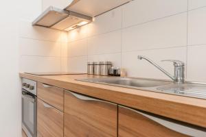 Kuchyň nebo kuchyňský kout v ubytování Apartments Kukuriku