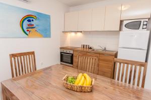 Kuchyň nebo kuchyňský kout v ubytování Apartments Kukuriku