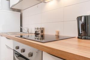 Kuchyň nebo kuchyňský kout v ubytování Apartments Kukuriku