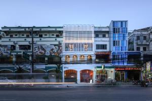 a building on a city street with at Hostel Our Nomad in Phuket