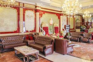 a living room filled with furniture and decor at Clifton International Hotel in Fujairah