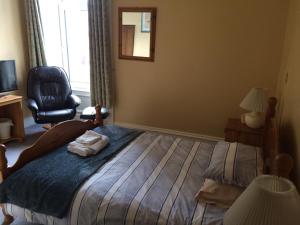 Cama ou camas em um quarto em Camillia Guest House