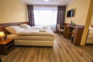 Postel nebo postele na pokoji v ubytování Hotel SiLL