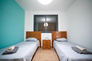 Postel nebo postele na pokoji v ubytování Paraiso Blue Dream