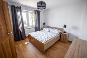 Posteľ alebo postele v izbe v ubytovaní Apartament Loft