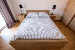 Łóżko lub łóżka w pokoju w obiekcie Apartament Loft