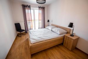 Łóżko lub łóżka w pokoju w obiekcie Apartament Loft