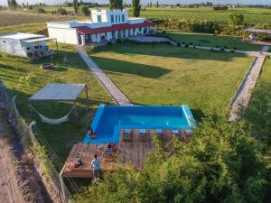 an overhead view of a swimming pool in a field at Villa Trinidad Guesthouse in Ciudad Lujan de Cuyo