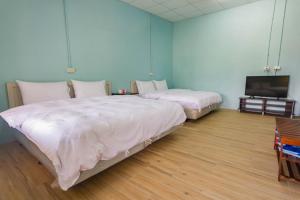Postel nebo postele na pokoji v ubytování Ruisui Village Homestay