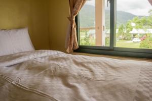 Postel nebo postele na pokoji v ubytování Ruisui Village Homestay
