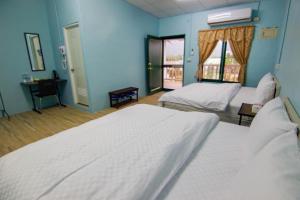Postel nebo postele na pokoji v ubytování Ruisui Village Homestay