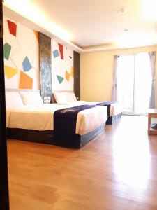 Voodi või voodid majutusasutuse 墾丁大街 皇佳旅店 toas