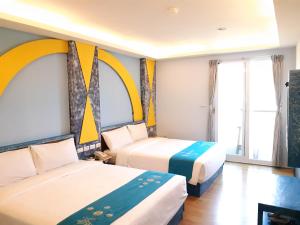 Voodi või voodid majutusasutuse 墾丁大街 皇佳旅店 toas