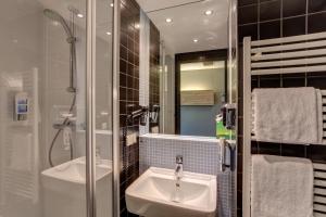 Koupelna v ubytování MEININGER Hotel Berlin Airport