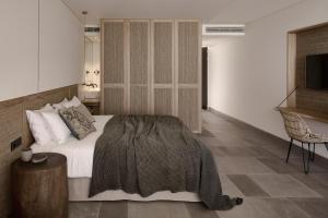 A bed or beds in a room at Olea All Suite Hotel, a Member of Design Hotels