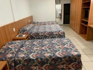Uma cama ou camas num quarto em Hotel Flat Alameda