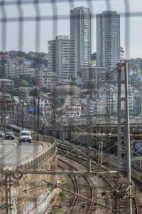 a view of a city with cars on a train track at Blanca Rosa Valparaiso B&B in Valparaíso