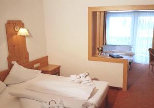 Łóżko lub łóżka w pokoju w obiekcie Hotel Nassereinerhof