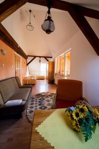 a living room with a couch and a table at Ani Konferencje imprezy Wypoczynek in Borne Sulinowo