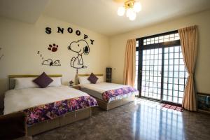Cama o camas de una habitación en Sinmanizu Homestay