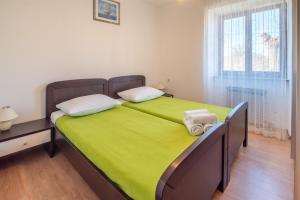 Posteľ alebo postele v izbe v ubytovaní Holiday apartment Angelina with Seaview and swimming pool