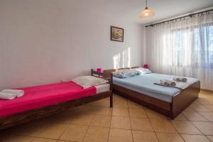 Posteľ alebo postele v izbe v ubytovaní Holiday apartment Angelina with Seaview and swimming pool