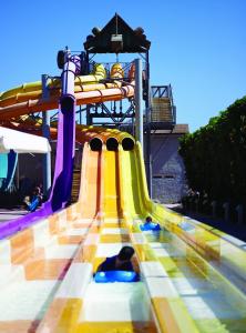 a slide at a water park with people on it at Coral Sea Aqua Club Resort in Sharm El Sheikh