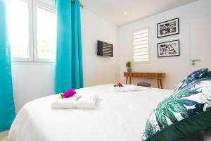 Voodi või voodid majutusasutuse Villas Rock & Beach toas