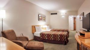 Säng eller sängar i ett rum på Sol Alphaville Hotel & Residence