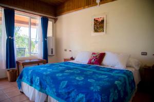 Säng eller sängar i ett rum på Hotel Taura'a
