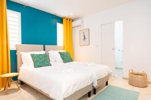 Voodi või voodid majutusasutuse Villas Rock & Beach toas