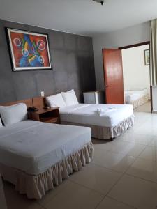 Ένα ή περισσότερα κρεβάτια σε δωμάτιο στο Hotel Arbol de Sueños