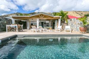 Villa con piscina y casa en MA CABANE PIEDS DANS L EAU, en Cul de Sac