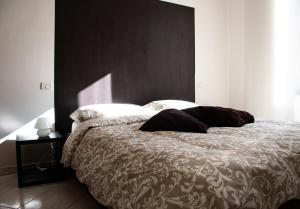 A bed or beds in a room at Alloggio Turistico al Civico n 32