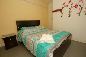 Cama o camas de una habitación en Hotel Santa Juana