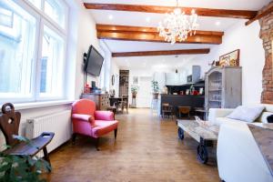 a living room with a couch and a table at Old Town Kalēju Street in Rīga