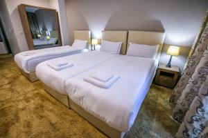 Postel nebo postele na pokoji v ubytování Hotel Andon Angelov
