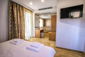 Postel nebo postele na pokoji v ubytování Hotel Andon Angelov