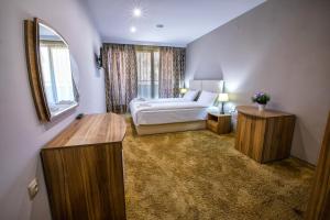 Postel nebo postele na pokoji v ubytování Hotel Andon Angelov