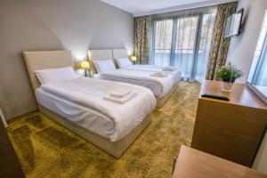 Postel nebo postele na pokoji v ubytování Hotel Andon Angelov