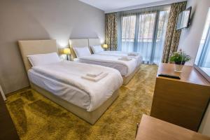 Кровать или кровати в номере Hotel Andon Angelov