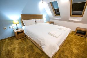 Postel nebo postele na pokoji v ubytování Hotel Andon Angelov
