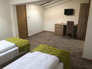 Llit o llits en una habitació de Gros Hotel - Leskovac