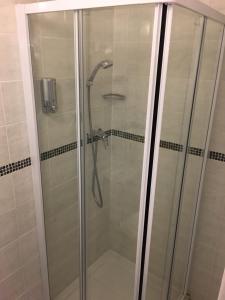 a shower with a glass door in a bathroom at Bella Vista Hotel in Weston-super-Mare +41 photos