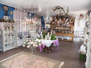 a room with a table with flowers and chandeliers at Chateau Saint Claude an der Saone in Mantoche +46 photos