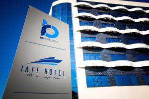 a hotel sign in front of a building at Iate Hotel Centro Florianópolis in Florianópolis