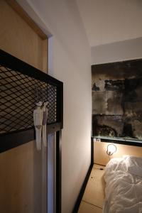 A bed or beds in a room at Semedaki, a modern appartment in the centre of history