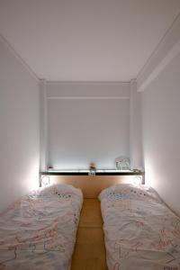 A bed or beds in a room at Semedaki, a modern appartment in the centre of history